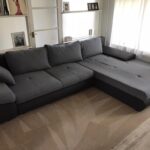 This is a photo of a grey L shape sofa that has been professionally steam cleaned, also the beige carpets have been steam cleaned too.